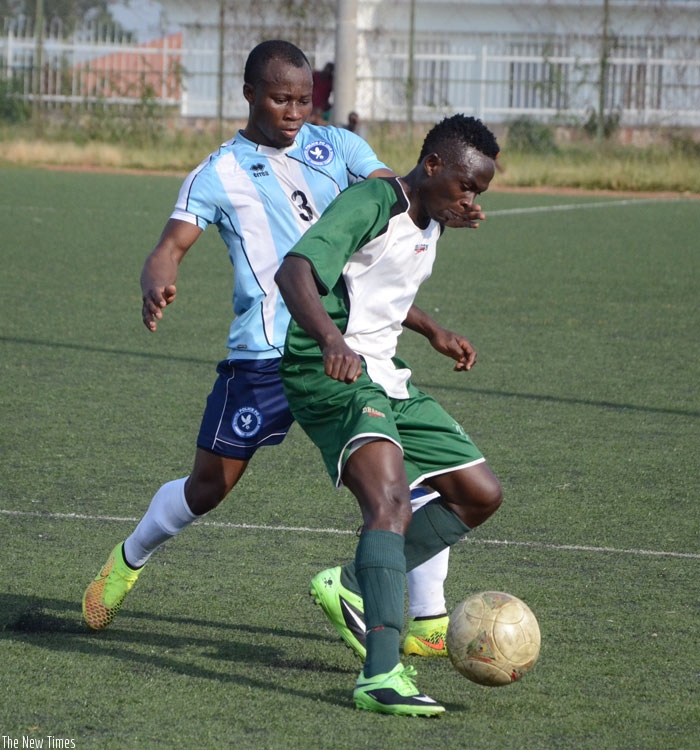 Police FC's left-back Ngirinshuti Mwemere (L) battles with Kiyovu striker America Kalisa during the Peace Cup quarter-finals. Both teams could meet in the semi-final of the Agaciro Development Fund tournament. (S. Ngendahimana)