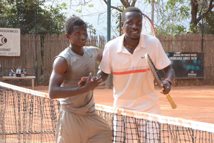 Habiyambere (L) is congratulated by Havugimana after he beat him in the final of Umubano Hotel Open yesterday. (Sam Ngendahimana)