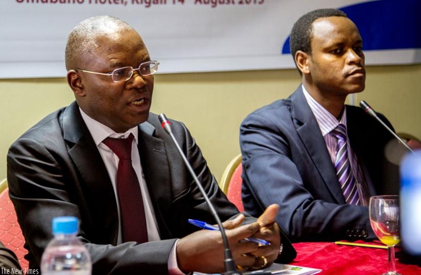 Mupiganyi (L) explains the importance of research on professionalism and accountability of Rwandan courts during the release of the TI-Rwanda study finds in Kigali last week. Looking on is Rukundakuvuga. (Doreen Umutesi)