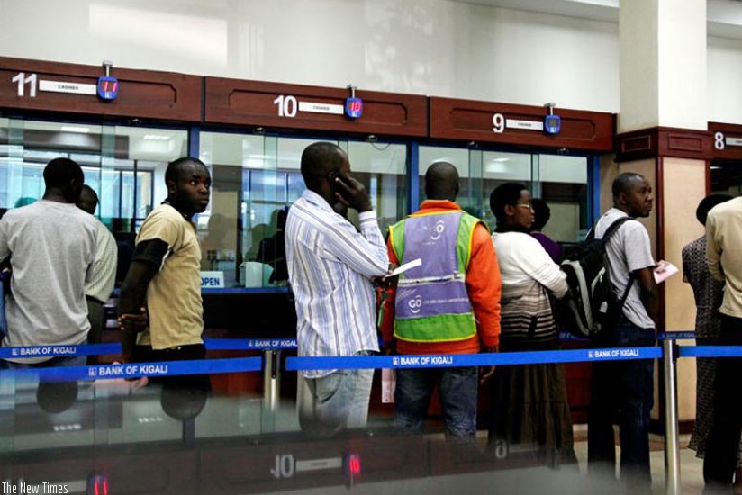Clients at a Bank of Kigali branch queue to get served.  (File)