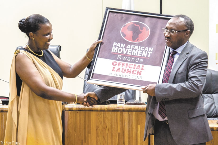 EAC Affairs Minister Valentine Rugwabiza (L), and Protais Musoni the Chairperson for the Pan-African Movement Rwanda Chapter at the launch of the movement in the country recently. (File)