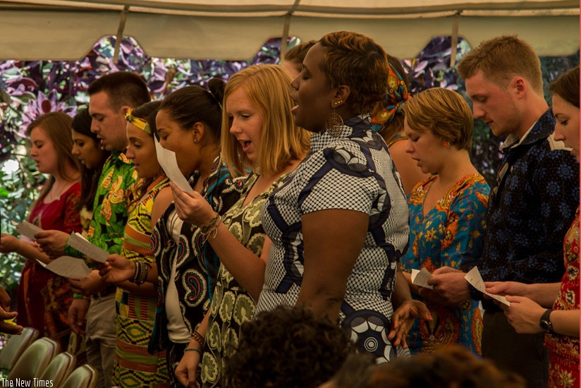 New Peace Corps volunteers take an oath during the swearing-in ceremony, at the US rnAmbassador's residence in Kacyiru yesterday. (Doreen Umutesi)