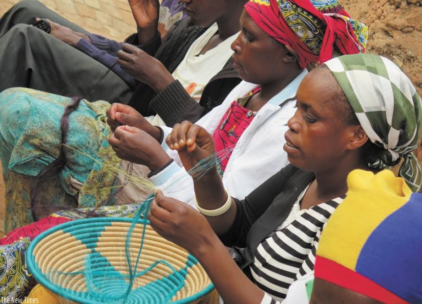 Ruhango District's Berwa Women's group members weave baskets. Such small projects have helped millions of rural poor to improve their livelihoods. (File)