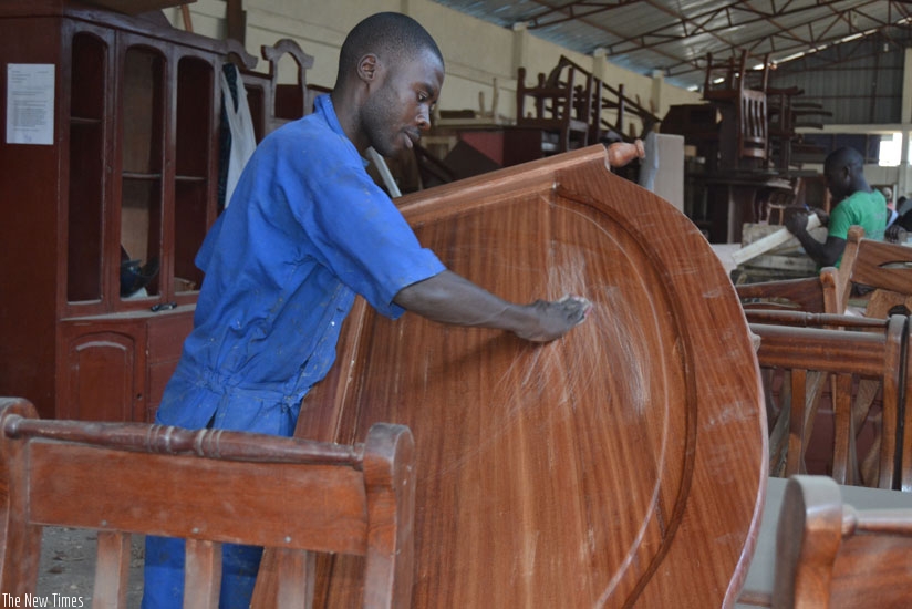 Bizimana makes a bed at his workshop in Rubavu District on Wednesday. (All photos by Jean d'Amour Mbonyinshuti)
