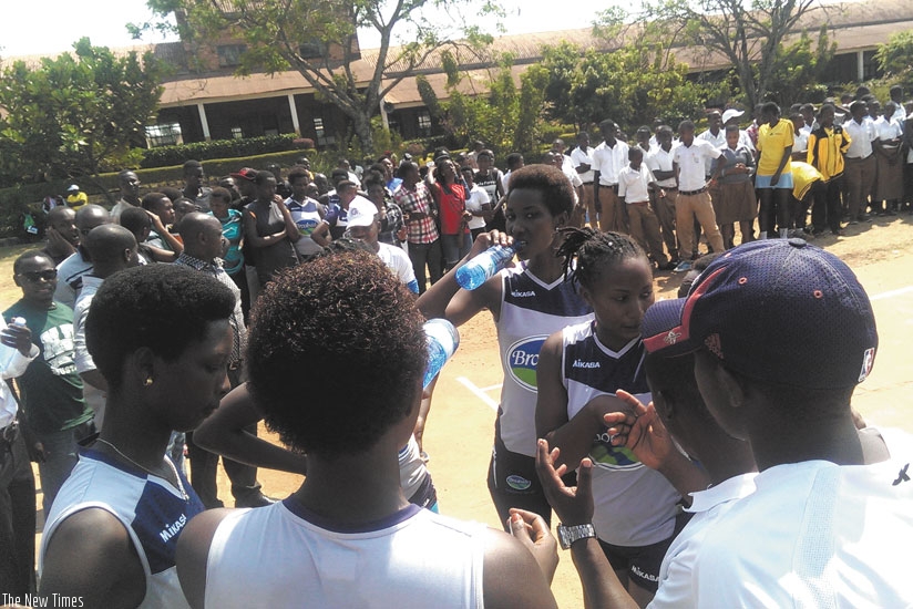 GS Indangaburezi players listening to a brifying during a time-out yesterday. (Richard Bishumba)