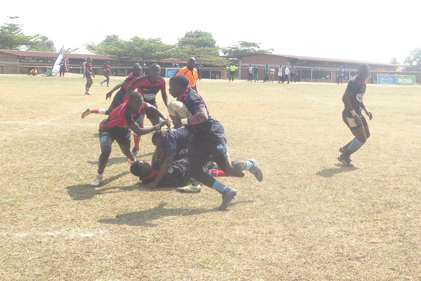 Ste Famille's Jean de Dieu Hakizimana makes a break for the last try in yesterday's Rugby 7s final. (Stephen Kalimba)