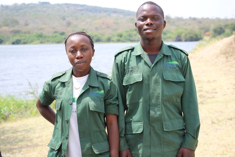 Nishimwe (right)  with a fellow community freelance guide. The duo is part of a larger group that has helped ease pressure of demand for guides at Akagera.  (Photos: Sarine Arslanian)