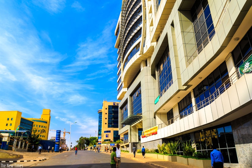 Pedestrians walk through the car-free zone at KN 4 Avenue in the Central Business District yesterday. (T. Kisambira)