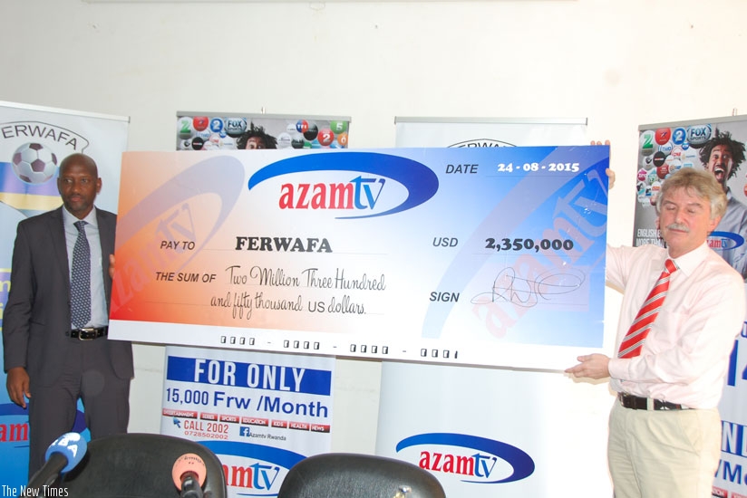 FERWAFA president Vincent de Gaulle Nzamwita (L) poses for a photo with Azam TV CEO Rhys Torrington. (Courtesy)