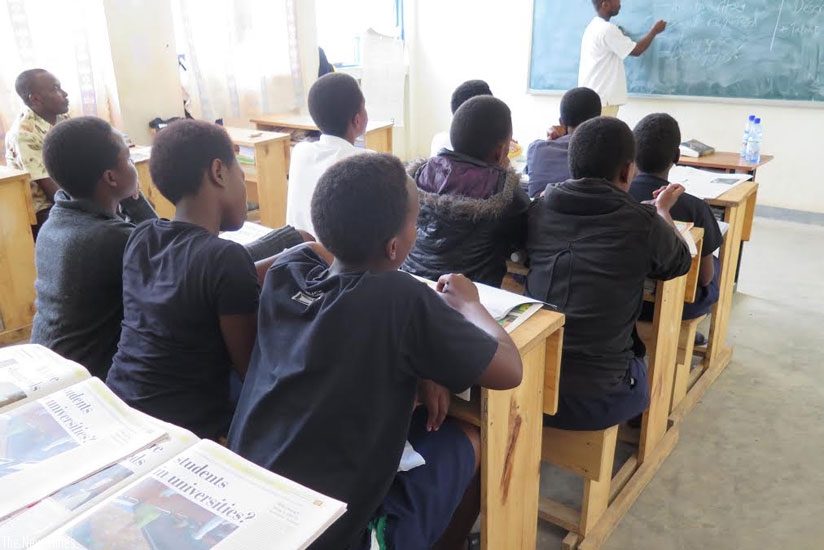 Students attend an English lesson. Peace corps volunteer in schools in an effort to improve quality of education. (Solomon Asaba)