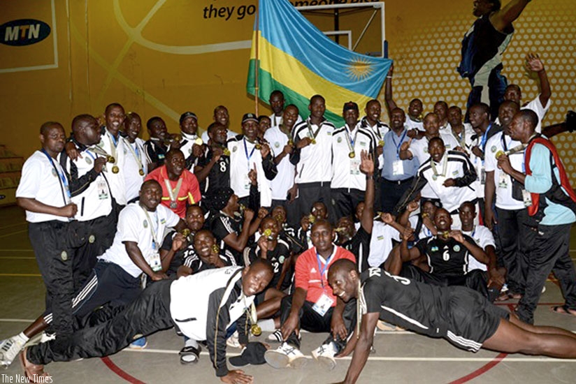 The RDF handball and basketball teams celebrate together after their triumph in the EAC Military Games in Kampala on Monday. (Courtesy)