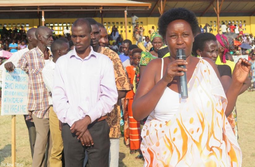Residents of Rwesero Cell, Nyanza District,  express their views about amending the Article 101 the Constitution to allow President Paul Kagame run for another term. This was at Nyanza Stadium on July 25. (Emmanuel Ntirenganya)