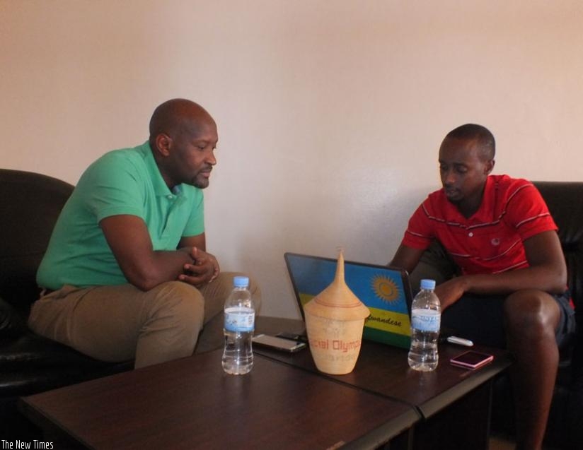 FERWAFA head Vincent Nzamwita (left) taking questions from Times Sport's reporter Peter Kamasa. (Courtsey)