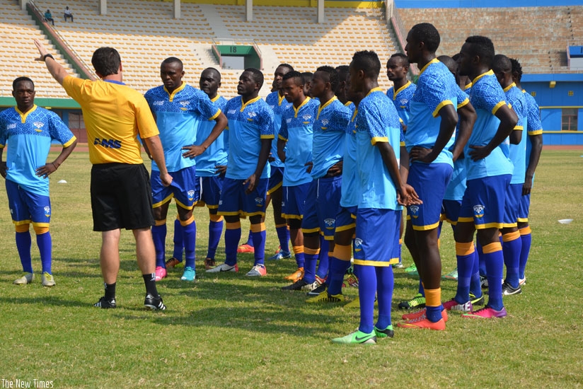 McKinstry (back to camera) briefing his players during a training session at Amahoro National Stadium. (Sam Ngendahimana)