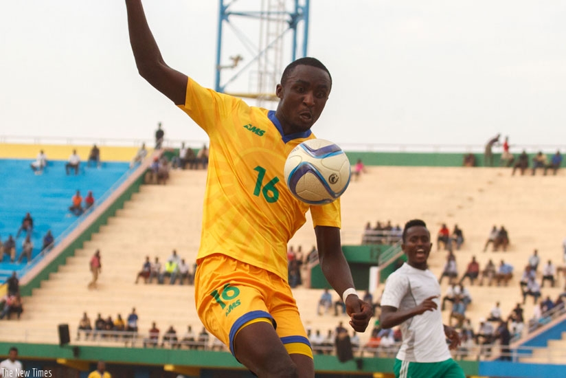 Amavubi striker Ernest Sugira, who converted the first goal controls the ball during yesterday's match against Ethiopia at Amahoro stadium. Amavubi won 3-1. (T. Kisambira)