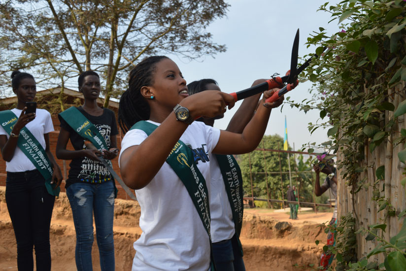 The Miss Earth contestants took part in the monthly community service Umuganda, in Gitega, Nyarugenge District on Saturday. (Stephen Kalimba)
