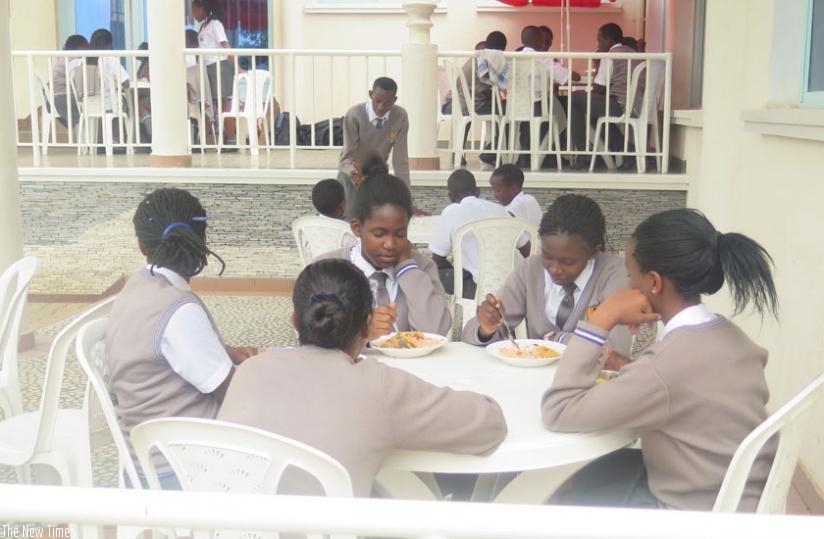Students of Excella School in Kigali take lunch at school. (Solomon Asaba)