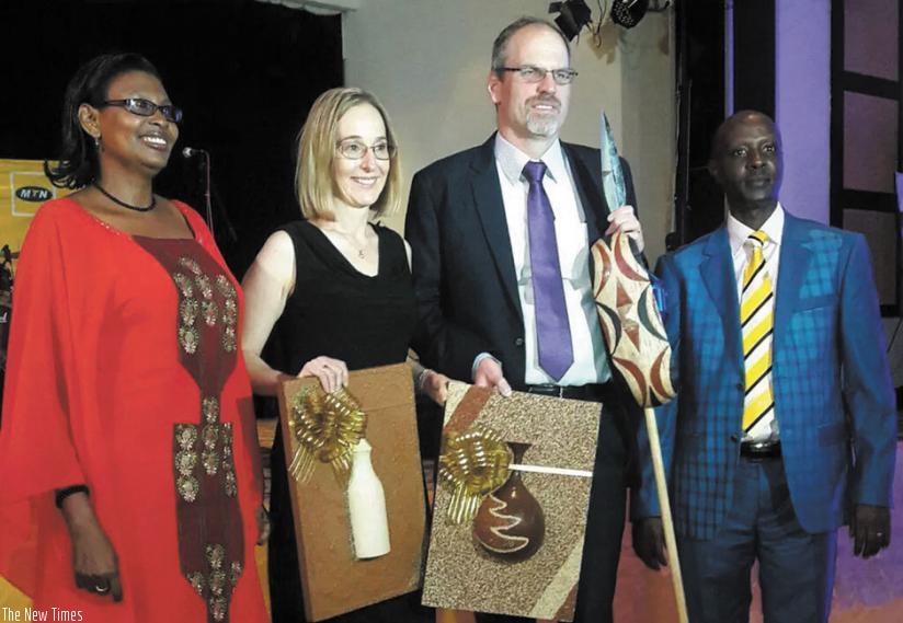MTN new chief executive Engling (second right) and his wife Christine, were received with traditional gifts. Mary Asiimwe (left), MTN head of HR and Norman Munyampundu, the MTN Business chief, accompanied them. (Courtesy)