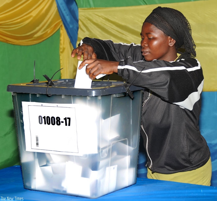 A woman casts her vote during a past election. In many African countries democracy has been reduced to perodic elections which some observers say are intended to confer international legitimacy. (File)