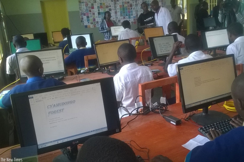Some students use computers inside the ICT lab at Bisate primary and secondary school on Wednesday. (J. Mbonyinshuti)