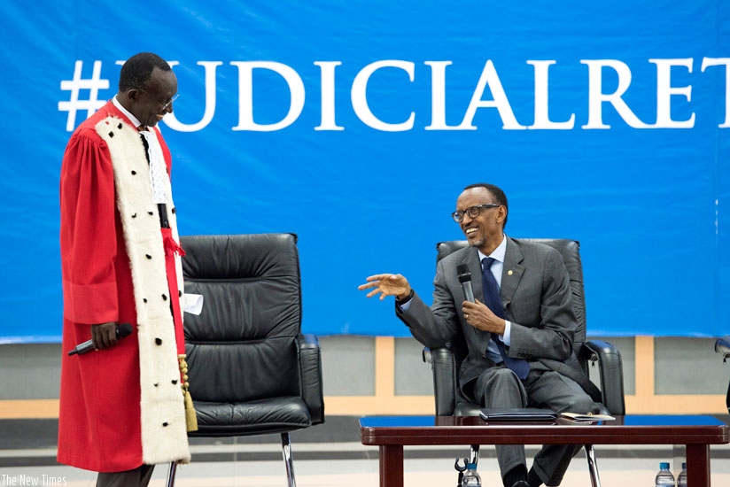 President Kagame and Chief Justice Sam Rugege share a light moment at the launch of the new judicial year for 2015/16 at the Rwanda Defence Forces Combat Training Centre in Gabiro, Eastern Province, yesterday. (Village Urugwiro)