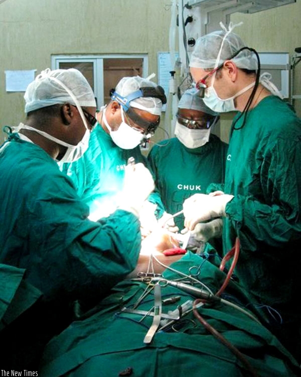 Doctors operate on a patient at CHUK during the last day of the outreach programme on Friday. (Courtesy)
