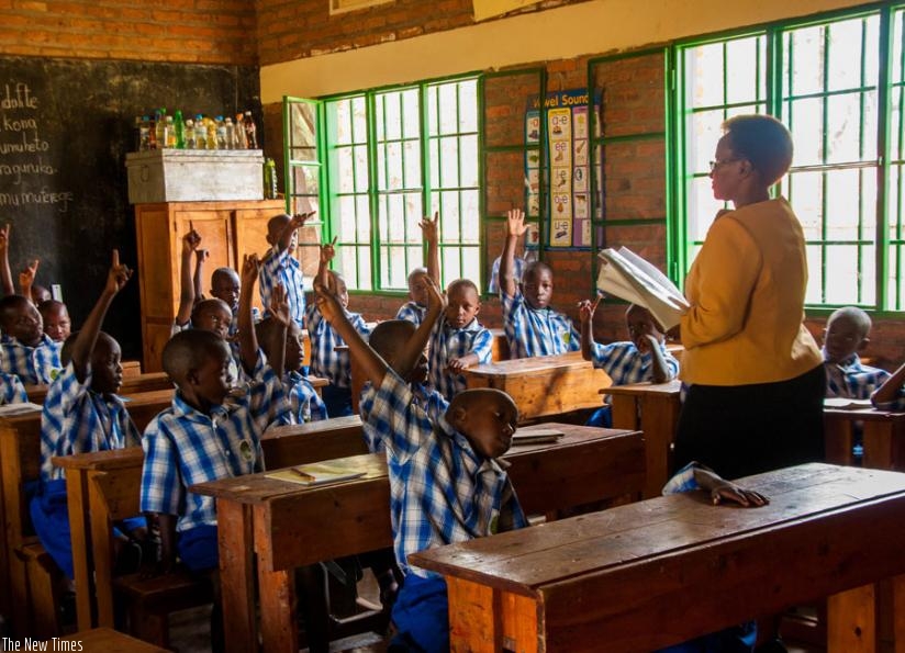 Musabe teaches Primary One pupils at Remera Catholic Primary School yesterday. (Teddy Kamanzi)