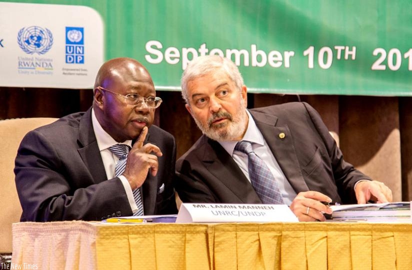 Lamin Manneh, the UNDP resident coordinator, speaks to Martinez-Soliman during the launch of the National Risk Atlas of Rwanda in Kigali yesterday. (Doreen Umutesi)
