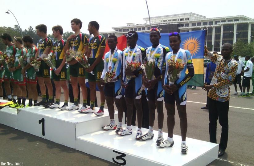 Team Rwanda riders (R), pose with the bronze medal on the podium after finishing third in Team Time Trial yesterday. (Courtesy)