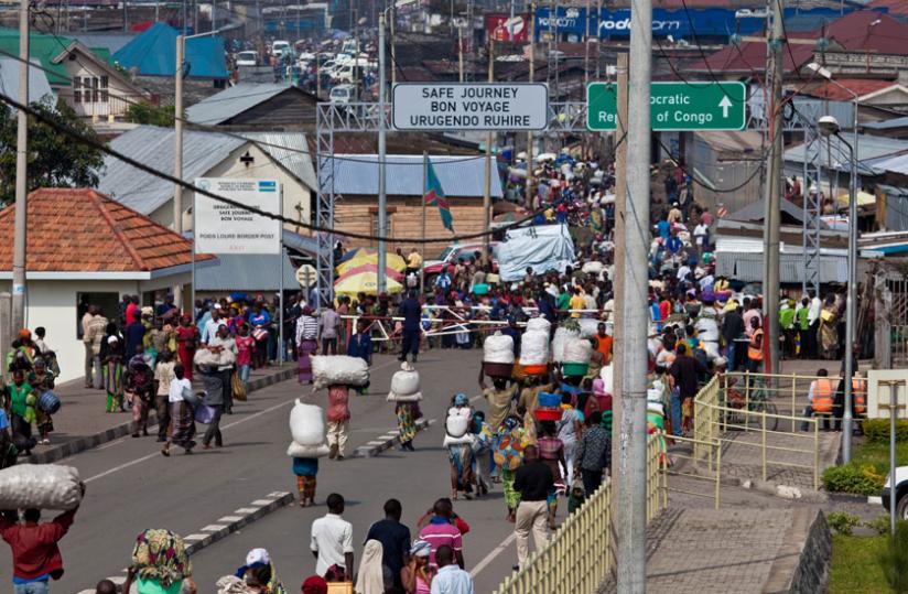 Rwandans transact business at the Rubavu-Goma border post. (Timothy Kisambira)