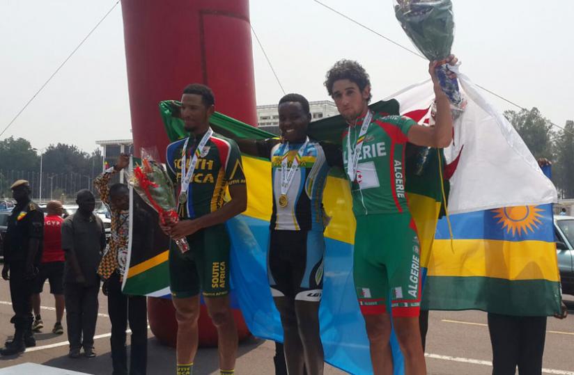 Rwanda's Janvier Hadi (C) poses with his gold medal alongside silver medalist Reynard Butler of South Africa (L) and bronze medalist Adil Barbari of Algeria (R). (Courtesy)