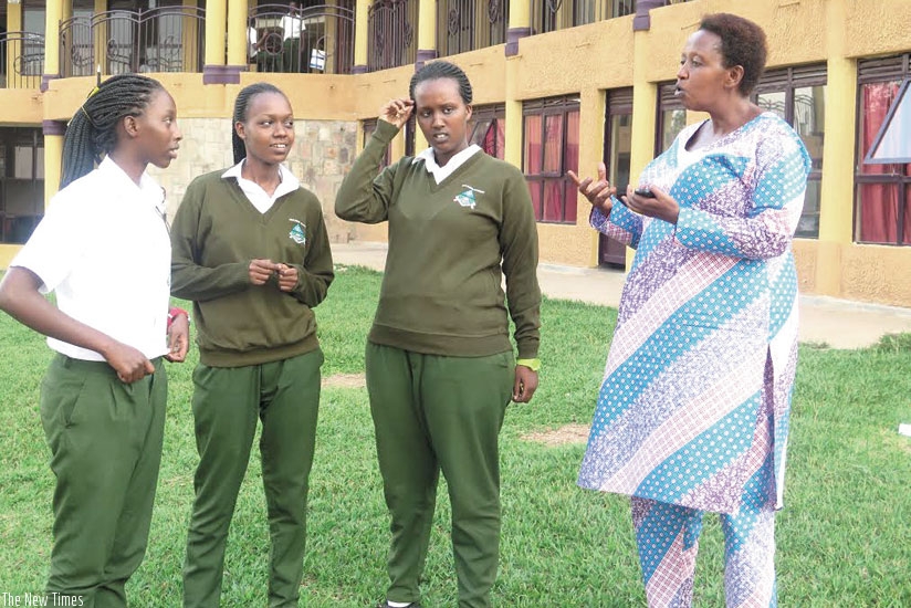 Batamuriza having a chat with her students. Many describe her as approachable and motherly. (Solomon Asaba)