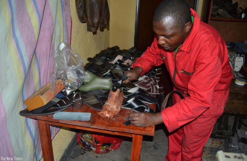 A man makes leather shoes. TVET graduates handle the jobs they get with professionalism. (File)