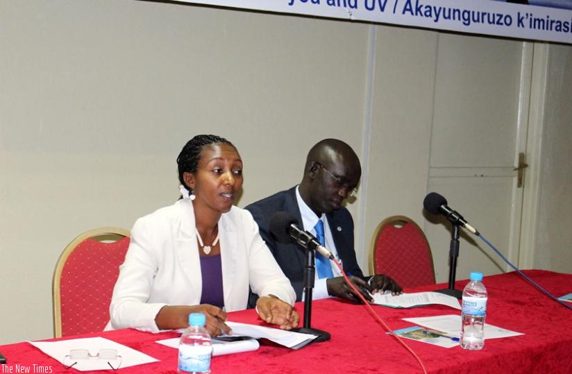 Eng. Ruhamya (L) briefs the media on raising awareness of ozone layer protection in Kigali yesterday as Dr Rudakemwa looks on. (Michel Nkurunziza)