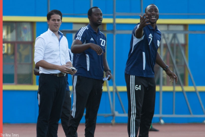 L-R; Mckinstry, Mashami and Mugisha on the touchline during Rwanda U23 team match against Uganda early this year. (T. Kisambira)
