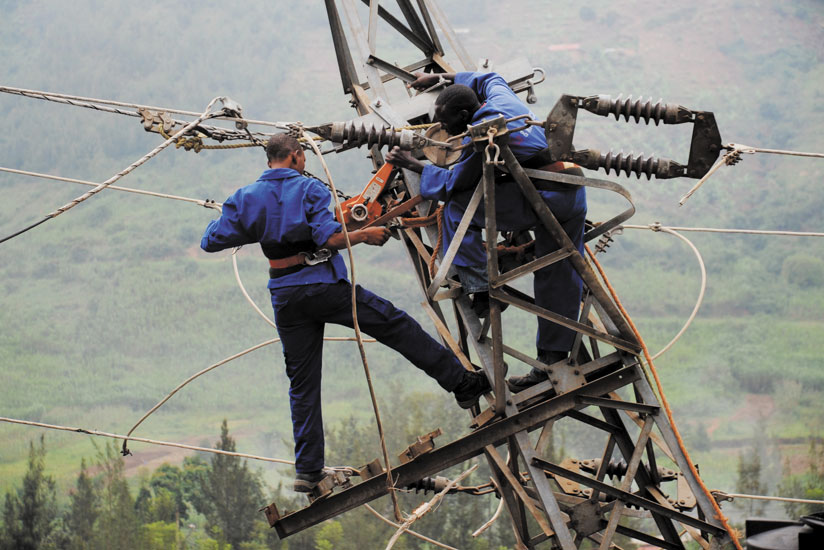 Workmen fix an electricity line. Top executives say aging power infrastructure is still a challenge. (File)