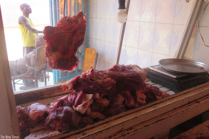Meat sellers wait for customers in Kimironko Market. Scarcity of cattle has led to a price hike. (Shamim Nirere)