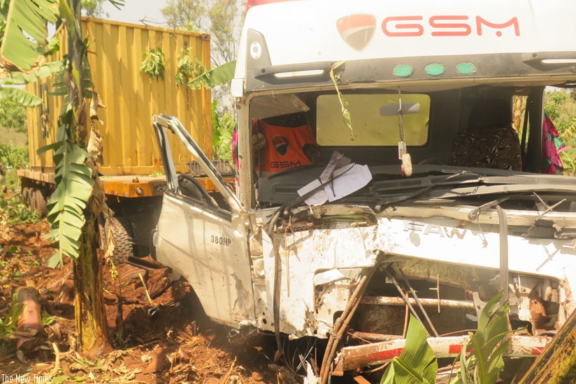 The cargo truck that smashed into an oncoming minibus. The driver was later arrested by the Police. (Stephen Rwembeho)