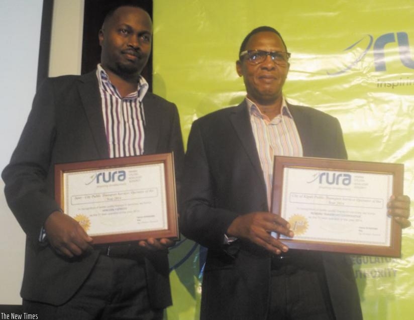 Gilbert Bihira (left), the Horizon Express chief and Twahirwa display their certificates of merit. (Jean Mugabo)