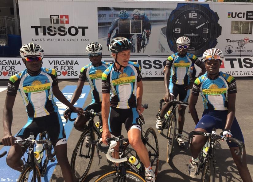 Team Rwanda cyclists pose for a photo with coach Jonathan 'Jock' Boyer (C) after training yesterday. (Courtesy)