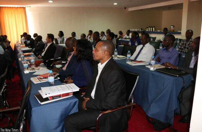 Participants  during the regional mobile for socio-economic development workshop in Kigali on Wednesday. (Julius Bizimungu)