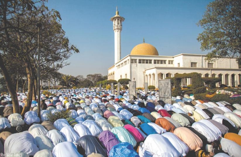 Muslims pray at Kigali Muslim Cultural Centre in Nyamirambo Eid al-Adha prayers yesterday. (Timothy Kisambira)