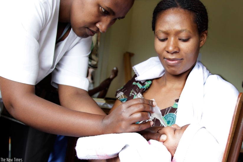 A nurse immunises a baby at Kacyiru Police Hospital. Rwanda is one of the few countries that achieved nearly all of the MDGs.  (File)