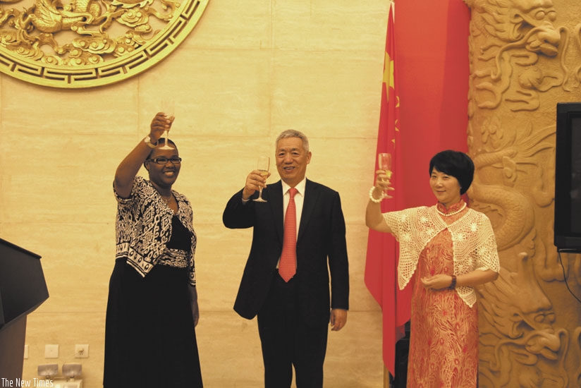 Agriculture Minister Geraldine Mukeshimana, Ambassador Shen Yongxiang and his wife toast to the good cooperation between Rwanda and China. (Courtesy)