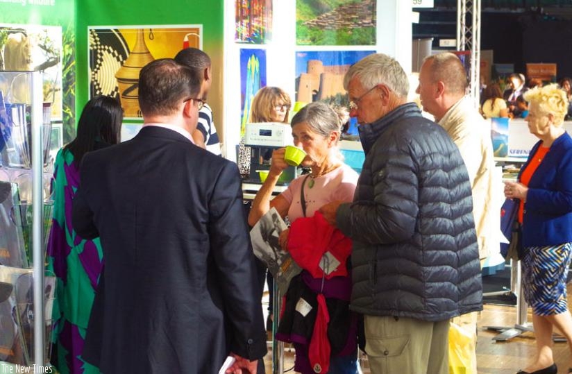 Visitors to the Rwanda stand at TUR Travel Fair in Stockholm sampling Rwandan coffee. (Courtesy)