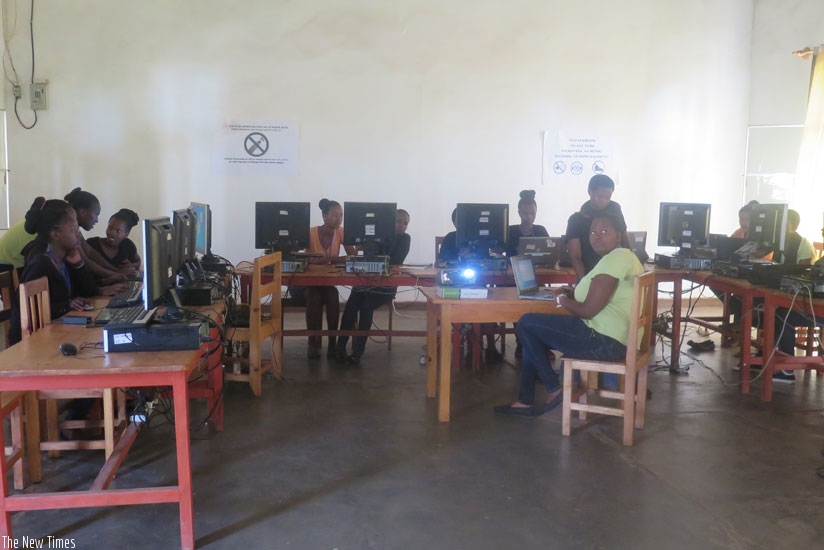 Girls at WDGS interact during a computer science lesson. (Elizabeth Buhungiro)