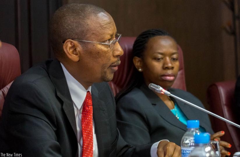 Central bank governor Rwangombwa and his deputy Dr Monique Nsanzabaganwa brief the media in Kigali yesterday. (Timothy Kisambira)