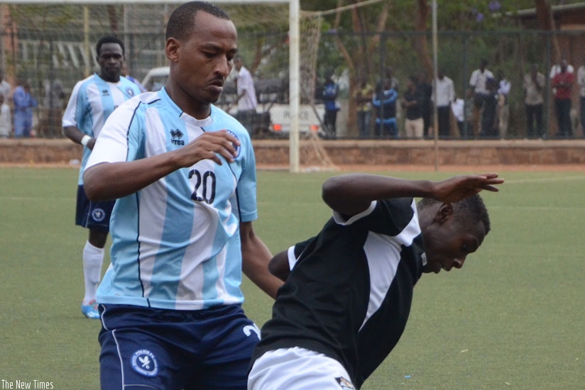 Hegman Ngomirakiza (L) marks APR's Janvier Benedata during the Azam Rwanda Premier League match this season at Kicukiro stadium. (S. Ngendahimana)