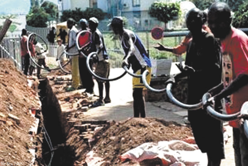 Technicians laying out a Fiber optic cable.