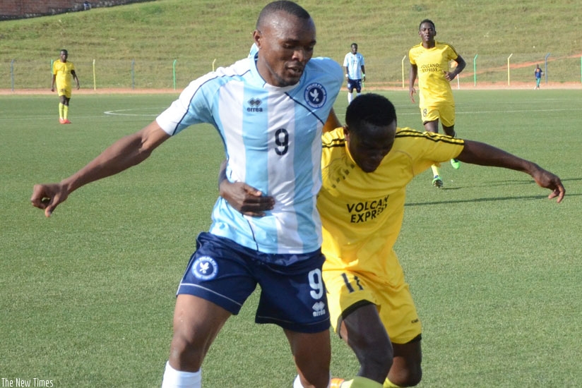 Police FC captain Jacques Tuyisenge (L) vies for the ball with a Mukura defender during the opening game of the season. Police lead the table after four matches. (S. Ngendahimana)